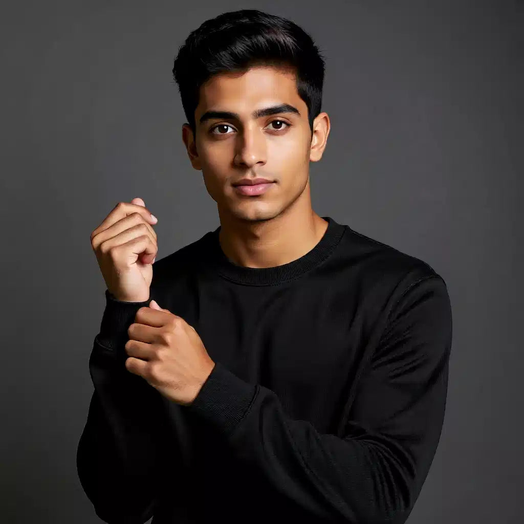 Man wearing a black sweatshirt against a dark background